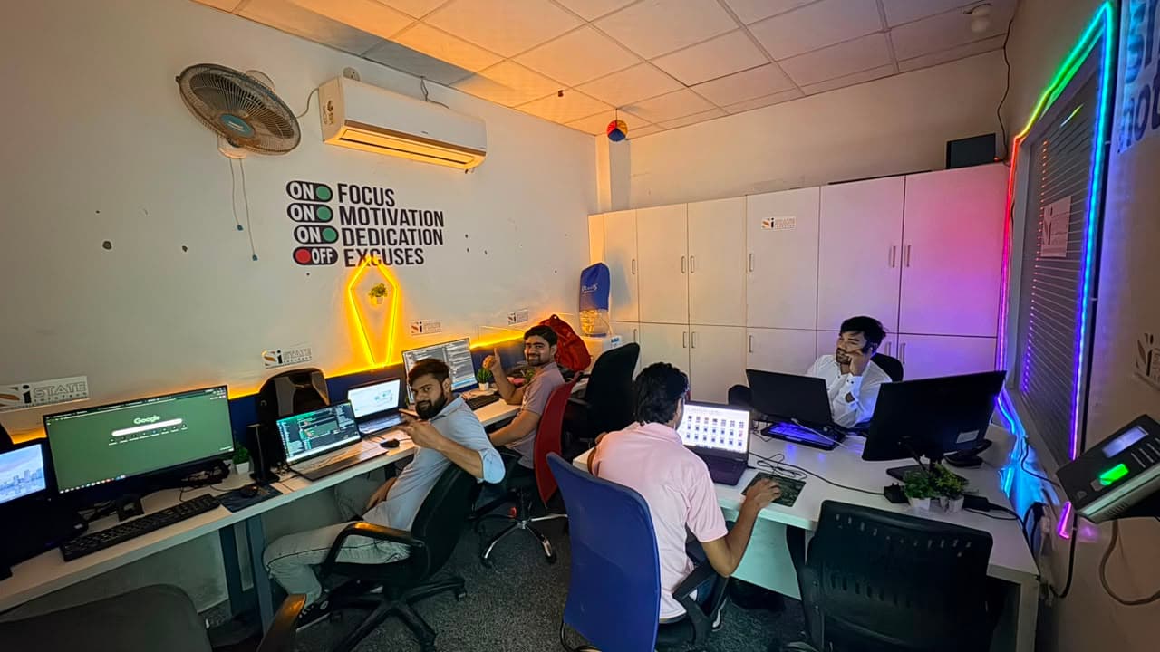 State Infotech team working together in the office